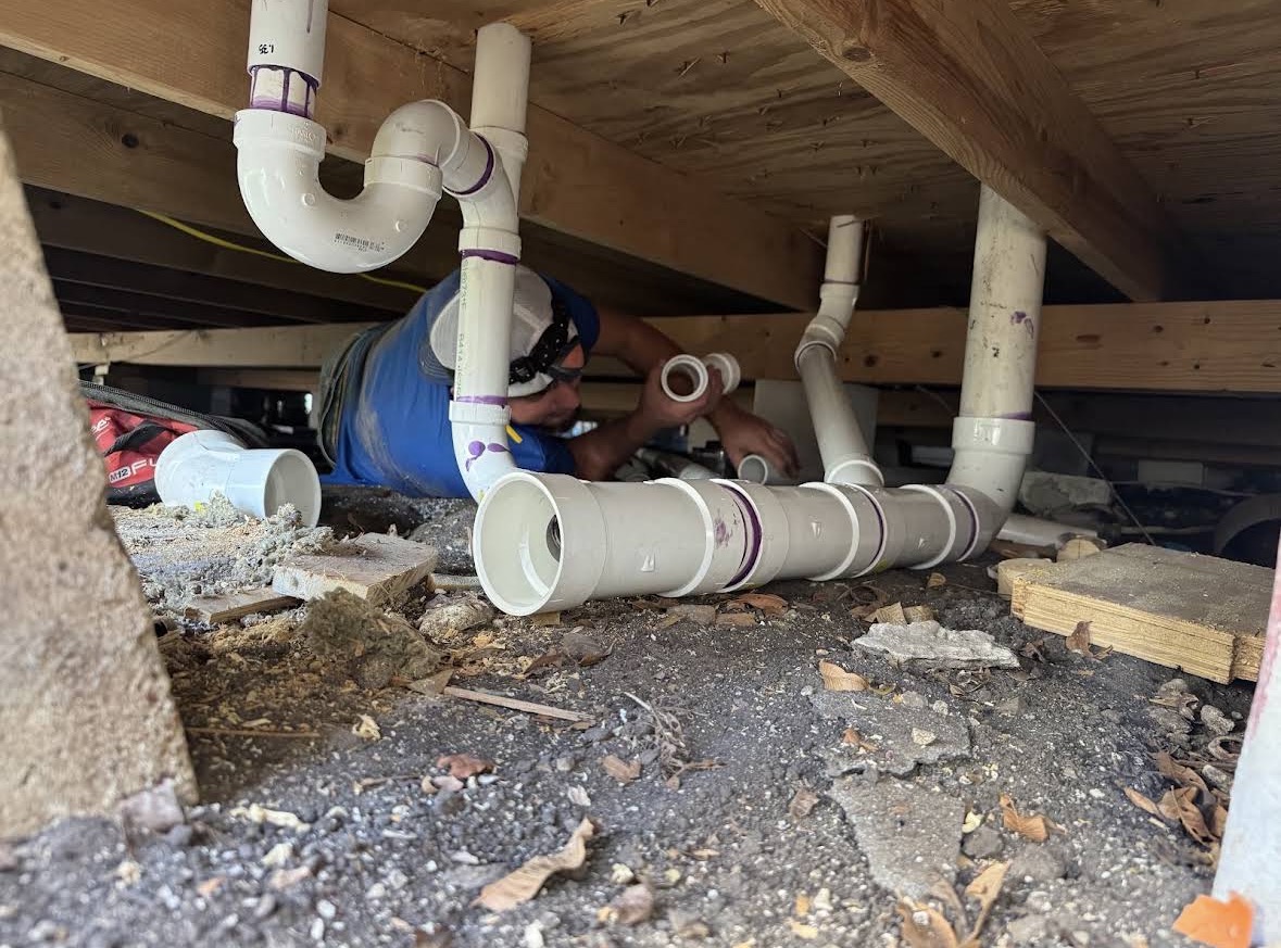 Under-house crawl space pipe work